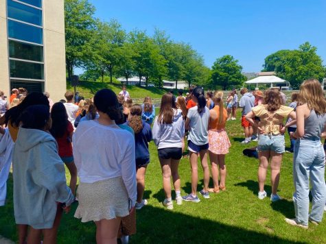 Students listen to a speaker at the walk-out to protest school shootings