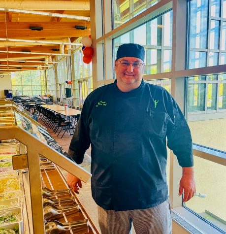 Executive Chef Wes Rosati next to the salad bar in Potomacs cafeteria