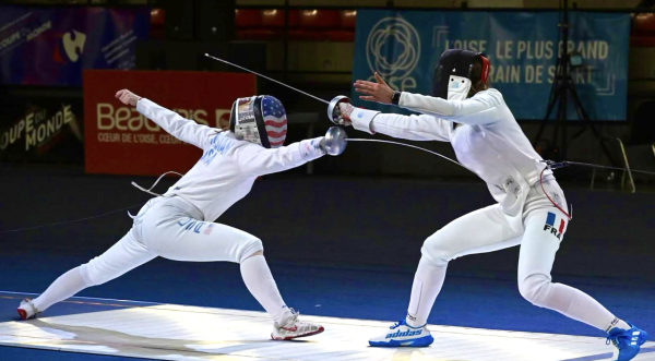 Hadley competing against a French fencer.